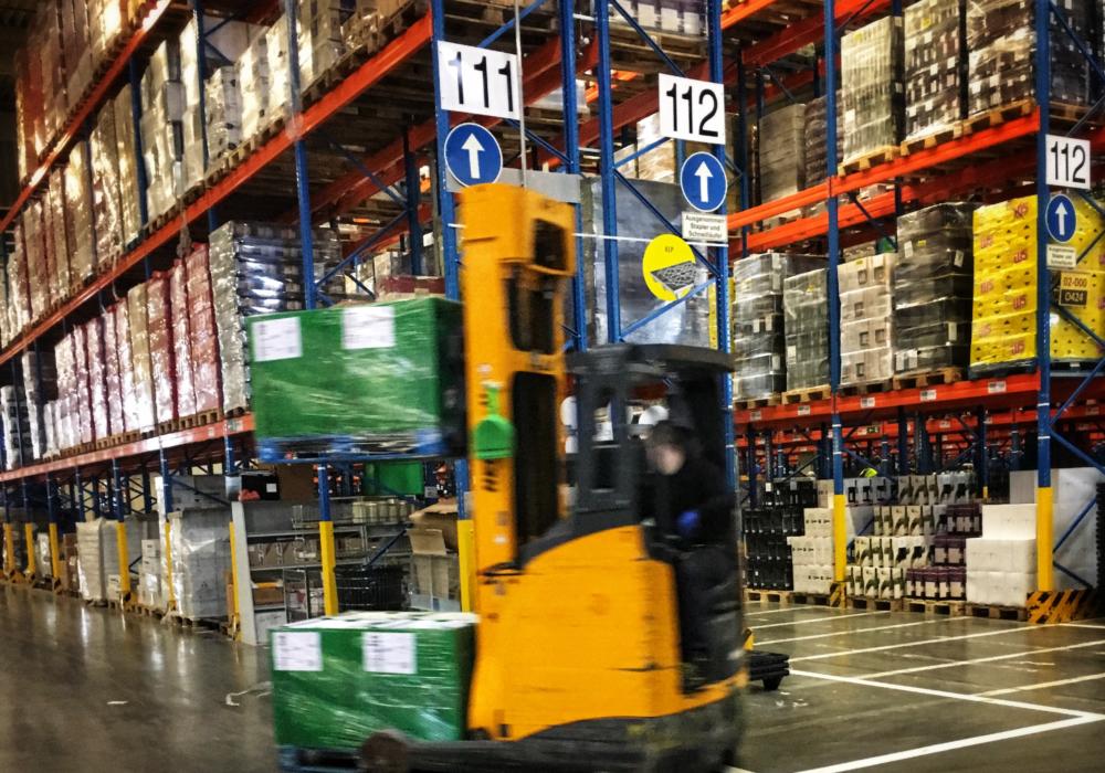 An Aboroginal forklift driver in a warehouse.